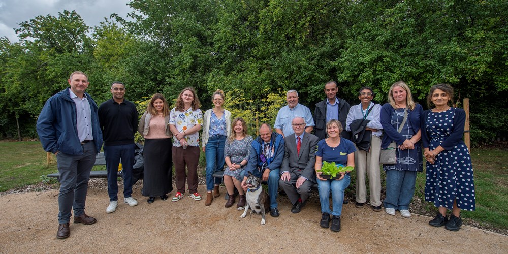 Community members, councillors and council staff at Meadow Gardens community garden