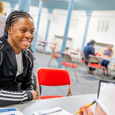 a picture of someone talking to an adult learning tutor