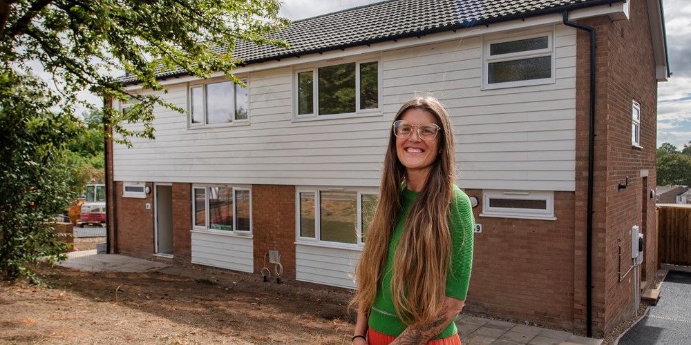 Cllr Cutkelvin outside a newly refurbished home at Hospital Close