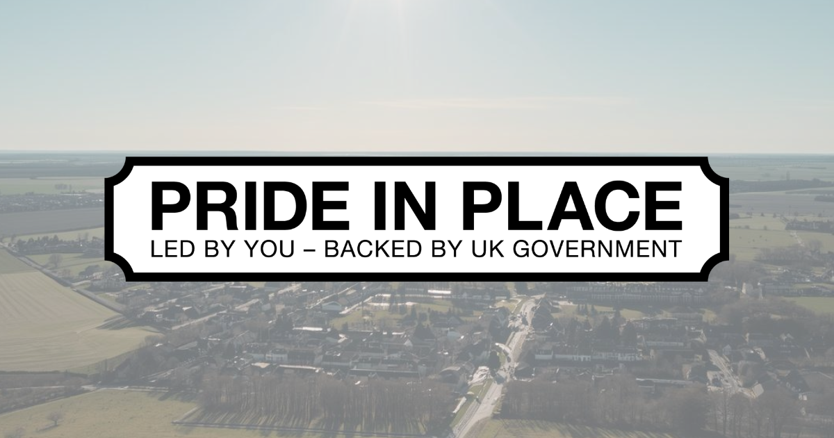 The words Pride in Place with a sunlit country landscape behind them