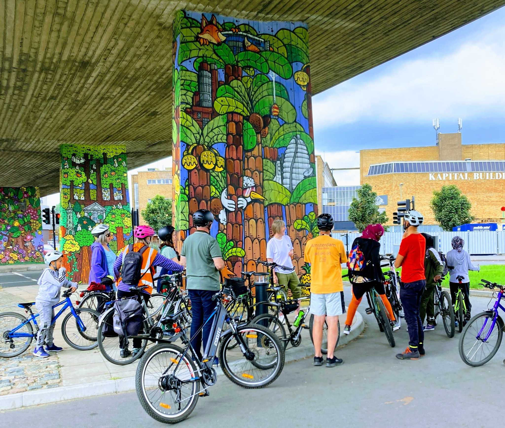 A picture of a guided street art bike tour from a previous Open Streets event