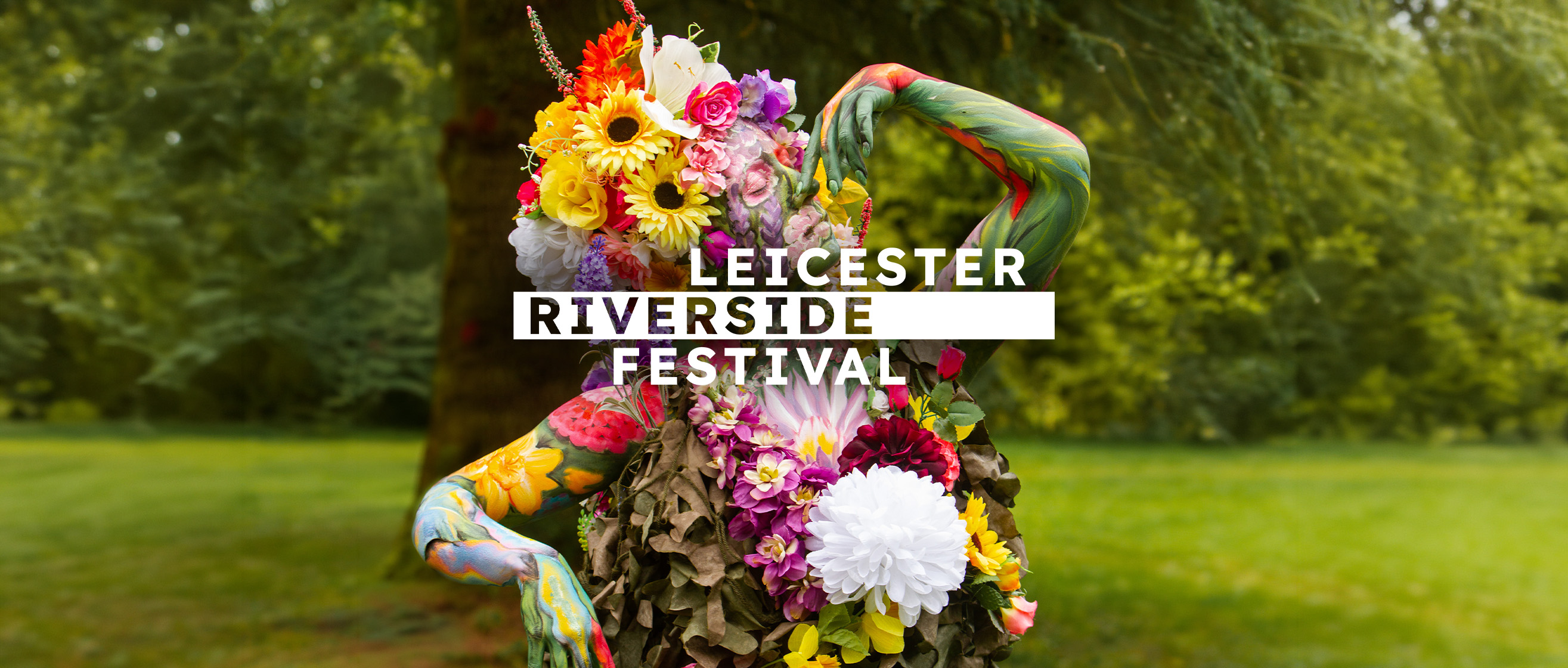 A woman in florals advertising the Riverside Festival in Leicester